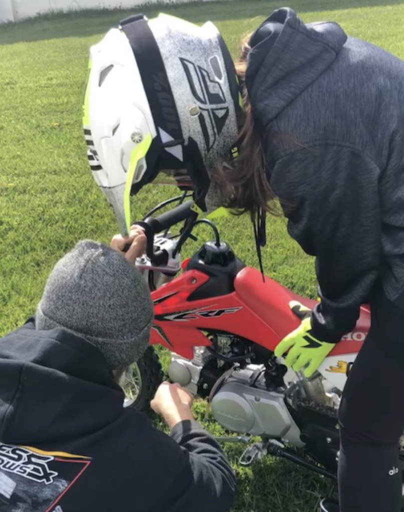 Leslie restarting the bike